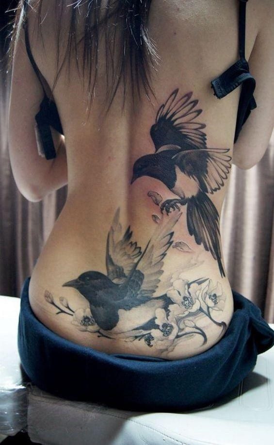 Black Large Bird Inspired Back Tattoo