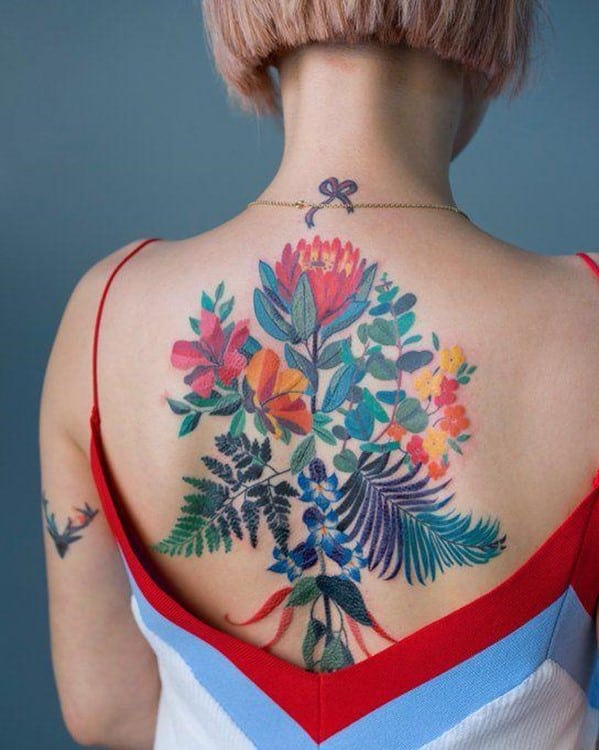 Dramatic Colorful Feminine Back Flower Tattoo