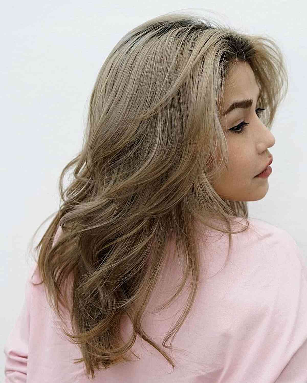 medium blonde butterfly haircut with soft layers
